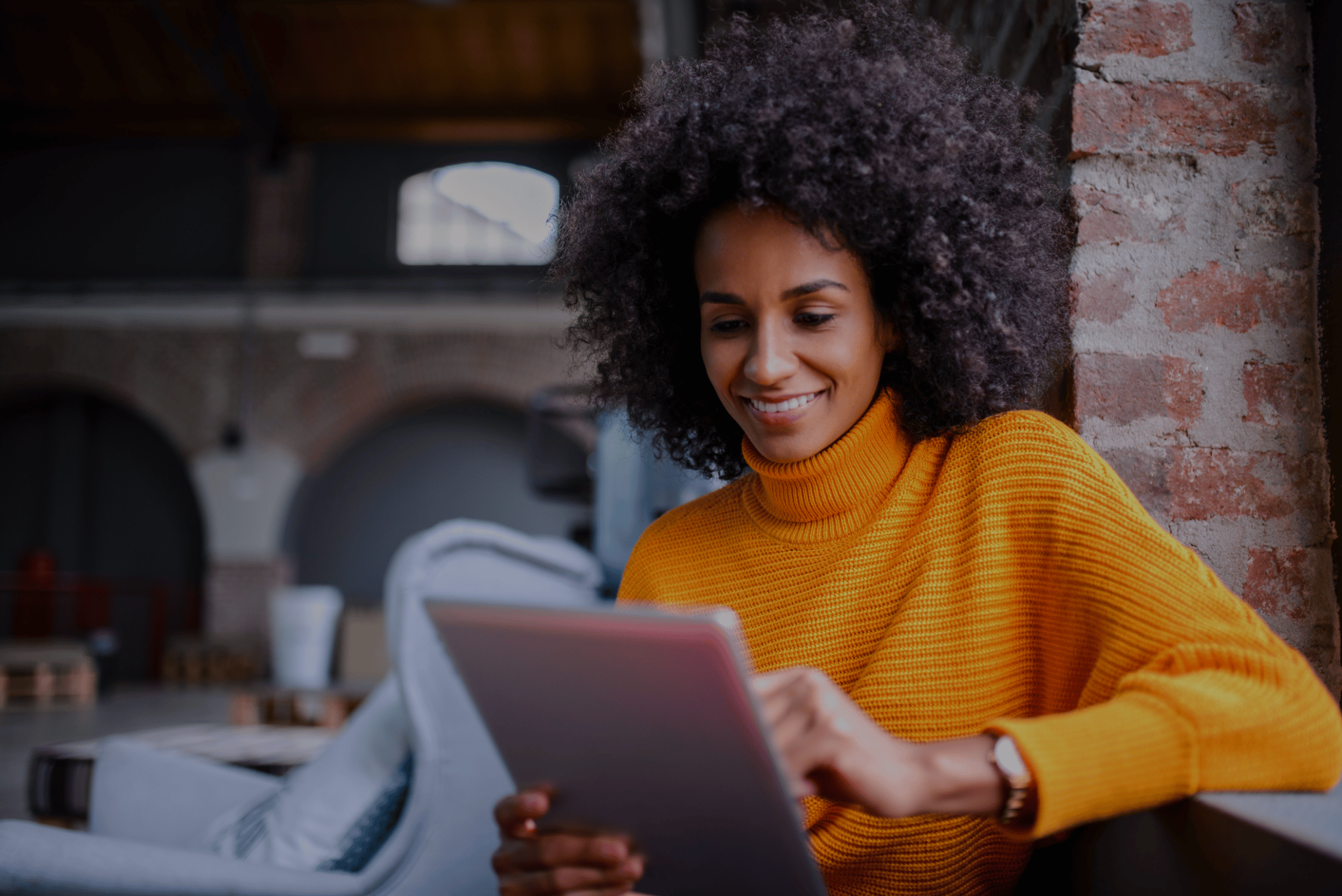 A person refinancing their auto loan on a tablet