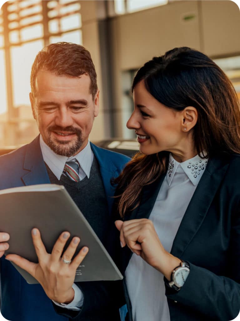 couple looking at lease end buyout options pamphlet