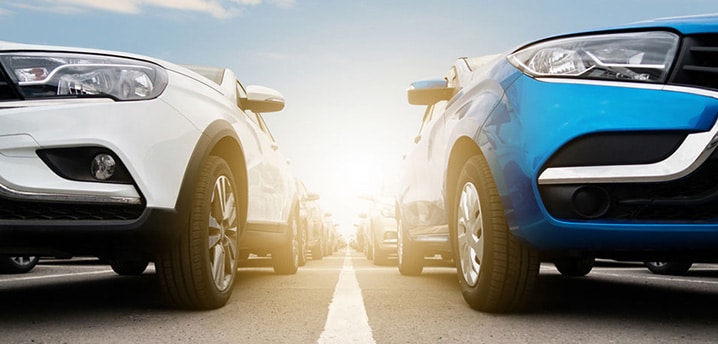 close-up of the front end of two cars