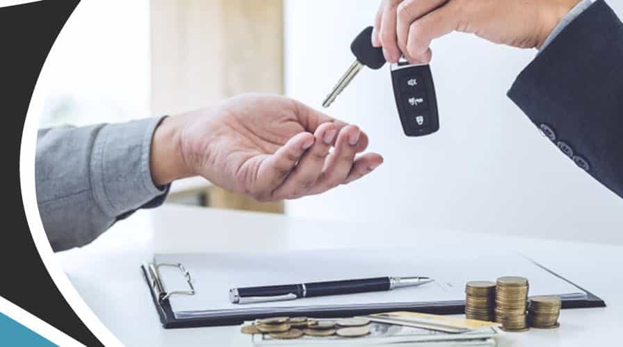 Person handing over keys to a car
