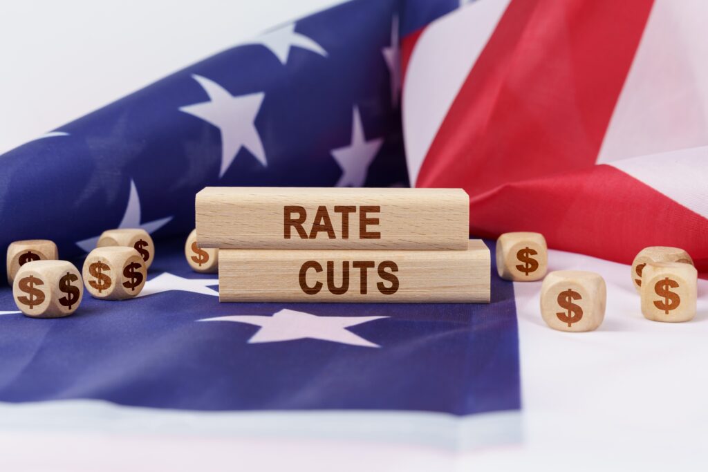 Rate cuts with dollar sign icons and American Flag in background