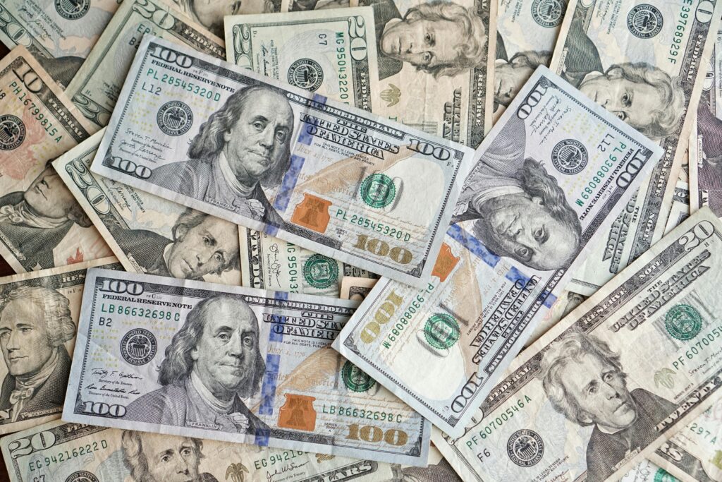 American currency laying flat, scattered around.