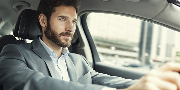 man driving a car