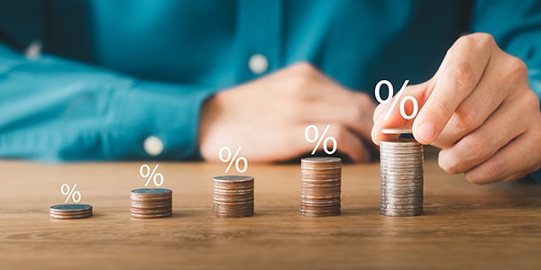 stacking coins with percentage symbol over each stack